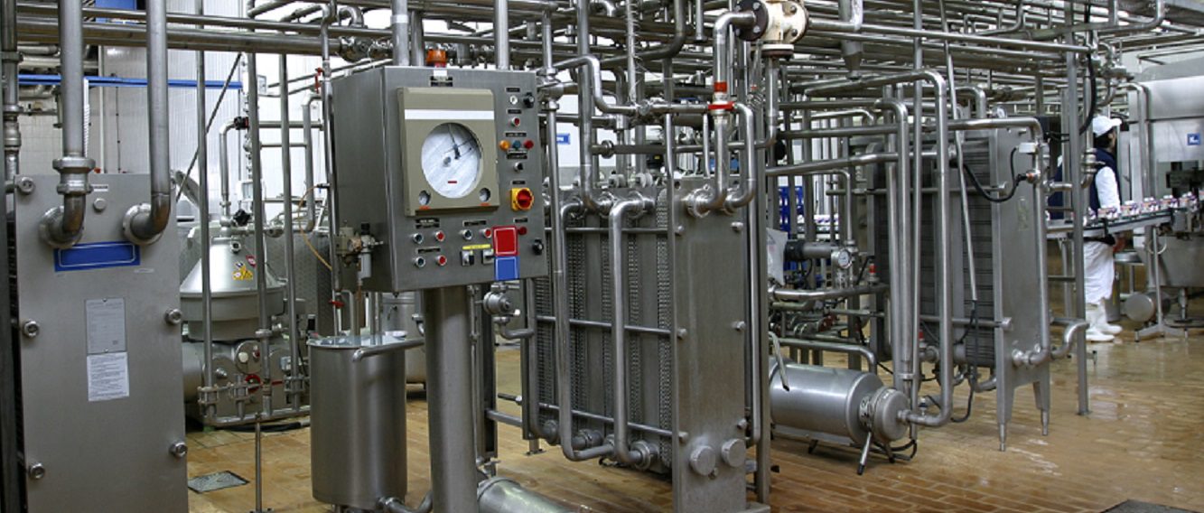 Stainless steel temperature control valves and pipes  in modern dairy
