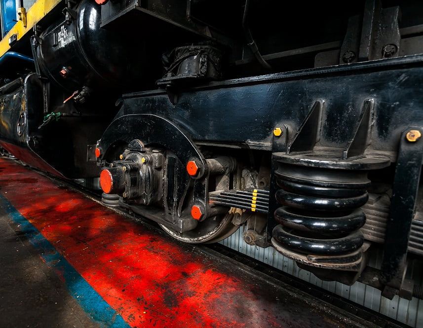 An old steam locomotive weels in a garage